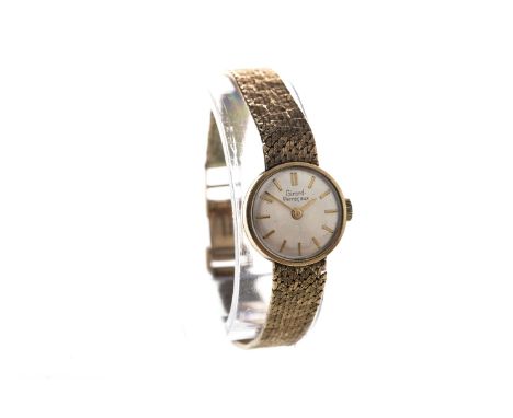 LADY'S GIRARD PERREGAUX NINE CARAT GOLD MANUAL WIND WRIST WATCH, the round cream dial with applied gold coloured baton hour m