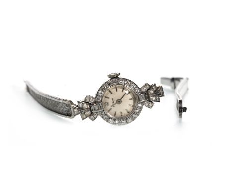 LADY'S MARVIN DIAMOND SET MANUAL WIND WRIST WATCH, the round white dial with applied baton hour markers, the 15mm case set wi