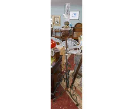 Oil lamp on adjustable metal stand 