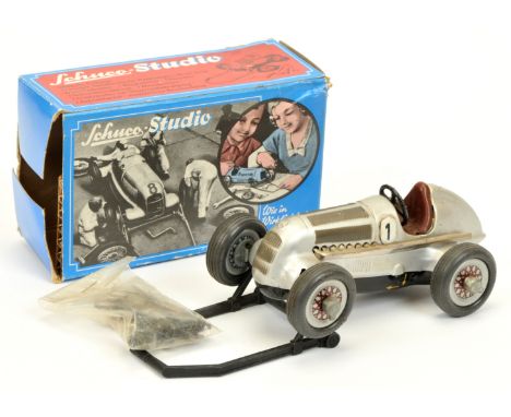 Schuco Studio 1050 Mercedes Racing Car, in silver with racing number 1, includes winding handle, stand, instructions, some to