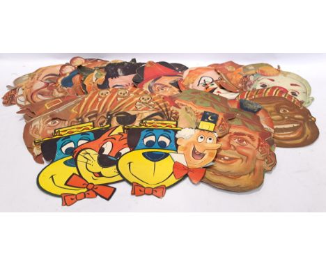 A unboxed group of "Vintage" Paper Masks. Includes Clowns, Animals with others. Condition appears generally Fair. See Photo.