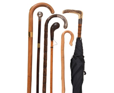  Five various walking sticks,   including: an Edwardian silver mounted bamboo by E. Blumenstein  &  Co., London 1906?; a Sund