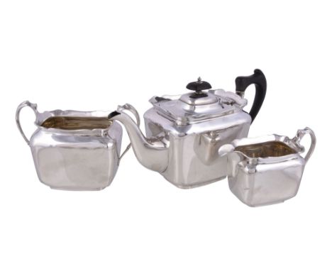  An Edwardian silver rounded rectangular three piece tea service by Lee  &  Wigfull,   Sheffield 1906-07, the tea pot with a 