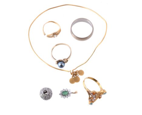 Please note, new description: A 9 carat gold band ring; a cultured pearl ring, stamped 14k; a pendant stamped 18k; an emerald