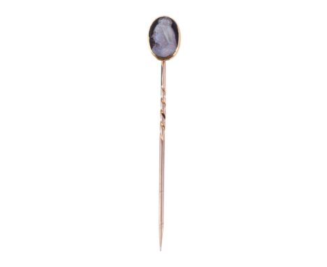  A late Victorian opal stick pin,   circa 1900,    the oval opal carved with Queen Victoria's profile, in a polished gold set