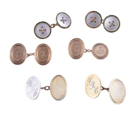 Ω A pair of Edwardian mother of pearl and enamel cufflinks , the circular mother of pearl panels within a border of green ena