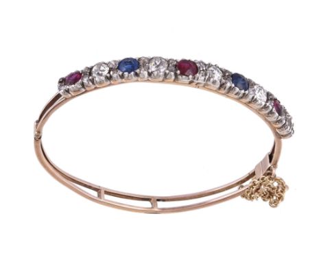  A Victorian and later diamond, ruby and sapphire bracelet,   set with alternating oval cut rubies, sapphires and old cut dia