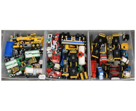 Lego a quantity of loose bricks and built models including Technic Crane, Police Vehicles, Cargo Vehicles, Fuel Tanker, some 