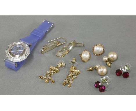 A gold-plated and pink enamel decorated bangle,by Halcyon Days,three pairs of Swarovski crystal earrings,a Swarovski crystal 
