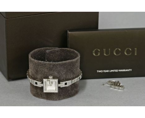 A lady's diamond set Gucci 102 Mini G stainless steel quartz bracelet watch,a mother-of-pearl square dial, with 'G' bezel, gr