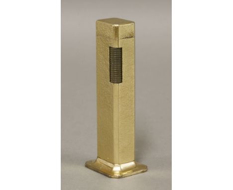 A Dunhill gold-plated tallboy table lighter,109mm in height, with a fine hammered finish.  No box