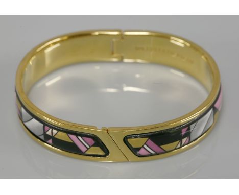 A gold-plated hinged and enamel decorated bangle,by Michaela Frey Team, in shades of black, gold and pink