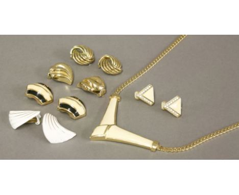 A gold-plated necklace by Christian Dior,with a cream enamelled 'V' shaped centrepiece,a pair of similar gold-plated clip-on 