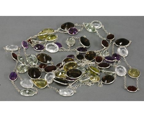 A sterling silver five row assorted gemstone necklace,with graduated oval faceted gemstones, to include smokey quartz, amethy