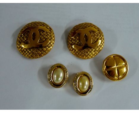 A pair of Chanel gold-plated clip-on earrings,composed of a large circular basket weave disc with applied back-to-back 'C' mo