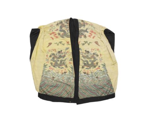 A robe fashioned from a Chinese yellow-ground embroidered silk 'dragon' boltThe silk, Qing dynasty, 18th centuryThe yellow-gr