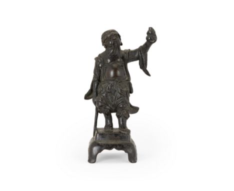 A small bronze figure of Li TieguaiMing dynastyCast standing on a square plinth, leaning on his crutch and holding a double-g