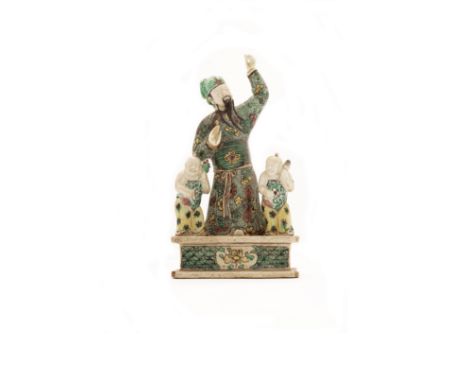 A Chinese famille verte on biscuit 'immortal' figure groupQing dynasty, Kangxi periodModelled as two attendants flanking an i