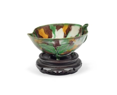 A Chinese sancai 'peach' brushwasherQing dynasty, Kangxi periodFormed as a peach, moulded with a leafy branch to the interior