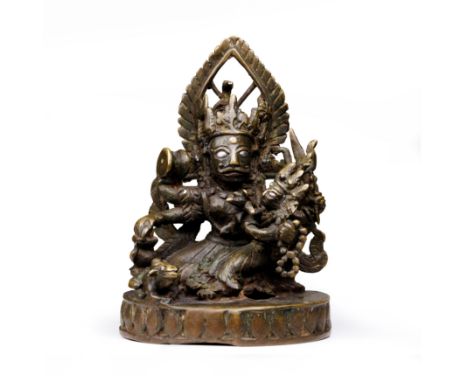 A Nepalese silver-inlaid bronze figure of Bhairava and Parvati17th centuryThe deity holding a trident, drum and kettle, flank