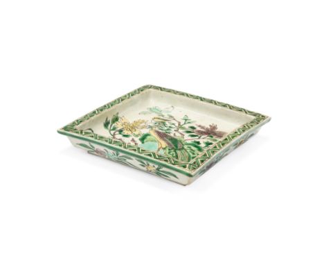 A Chinese famille verte on biscuit square trayQing dynasty, Kangxi periodPainted with a phoenix amidst rockwork and floral sp
