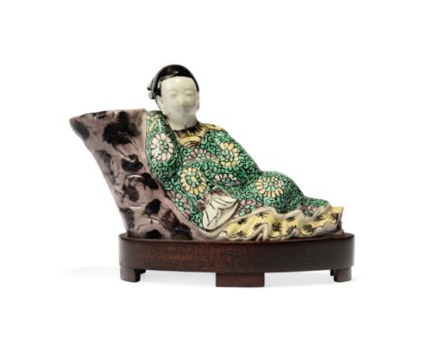 A Chinese famille verte on biscuit figural water dropper and water potQing dynasty, Kangxi periodModelled as a lady resting b