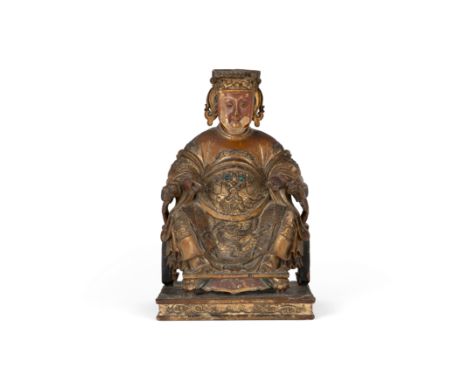 A Chinese gilt lacquer wood figure of MazuQing dynasty, Kangxi periodCarved seated on a horseshoe back chair wearing a flowin