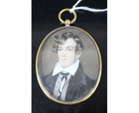 Mid-19th century English school - half-length portrait of a young man wearing a black tunic, miniature watercolour on ivory, 