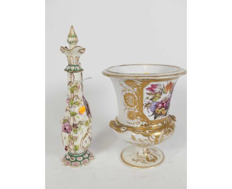 An early 19th century Derby porcelain urn, enamel decorated with flowers, h.20cm; together with a Victorian Rockingham style 