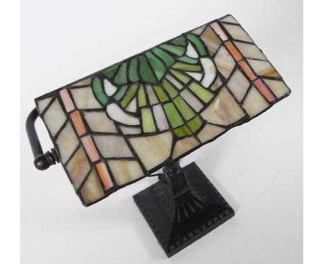 A modern desk lamp, having a Tiffany style coloured glass shade, h.32cm