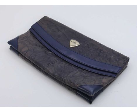 A lady's blue leather clutch bag, having a signed button clasp, w.31cm