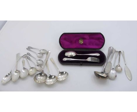 An early 20th century silver christening set to include fork with matching spoon in fitted purple lined leather case, togethe