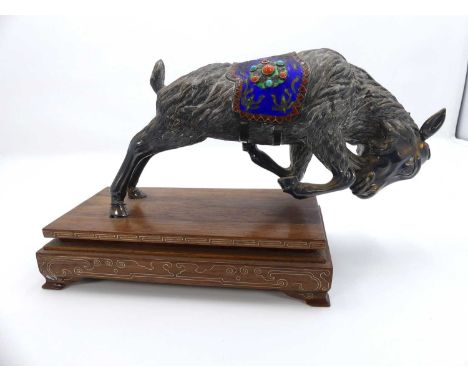 A Tibetan silver plated model of a goat, having a cloisonne enamel and hardstone inset saddle, mounted to wooden plinth, leng
