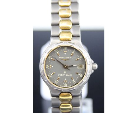 A Longines lady's titanium cased and gold plated quartz wristwatch, case dia.2.5cm 