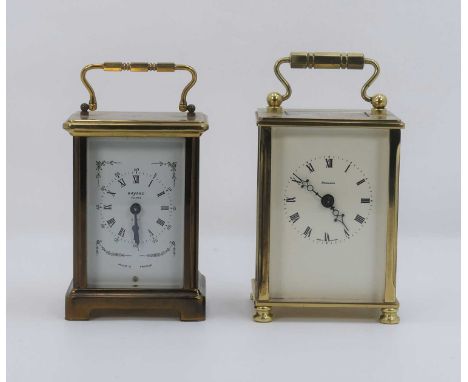 A lacquered brass carriage clock, having a white enamelled dial signed Dominion, showing Roman numeral markers, h.14.5cm; tog