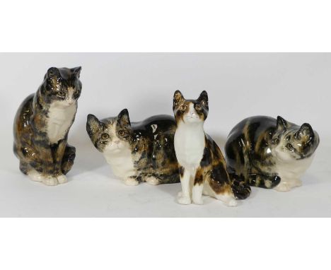 A collection of four Winstanley pottery models of cats, the largest h.30cmOne small chip to base of one cat (see image). Glaz