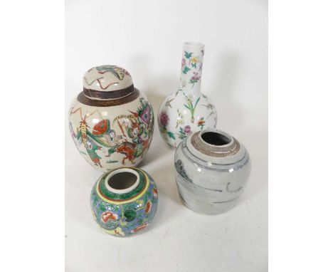 A Chinese Nanking ginger jar, enamel decorated with a battle scene, h.26cm; together with two further ginger jars and a vase 