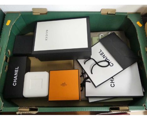 A collection of designer packaging to include Gucci, Chanel and Boucheron