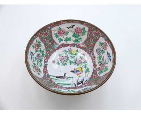 A Chinese Famille Rose enamel bowl, decorated with birds and chrysanthemums within shaped cartouches on floral ground, dia. 2
