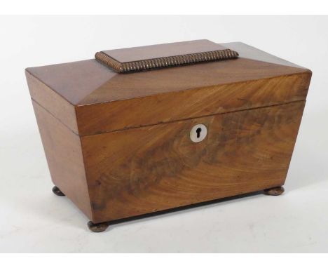 A 19th century mahogany tea caddy, of sarcophagus form, having a mother of pearl escutcheon, w.25.5cm 