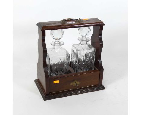 An Edwardian style mahogany two decanter tantalus, h.31cm