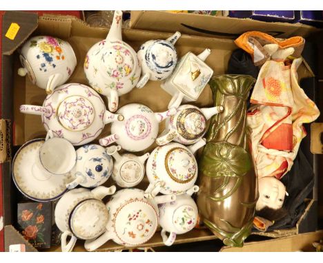 A collection of various porcelain bachelor's teapots, a Chinese doll, and an Art Nouveau style vase 