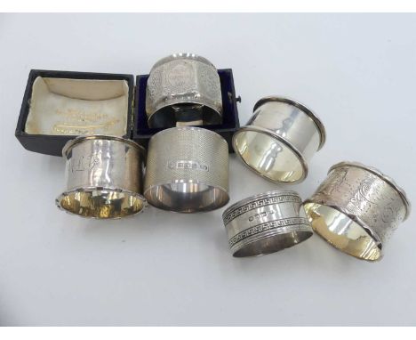 An early 20th century silver napkin ring, having foliate engraved decoration and vacant cartouche, in fitted leather case ret