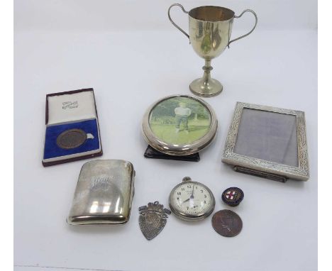 A George V silver pocket cigarette case, of rounded rectangular form, having monogrammed cover and gilt-washed interior; toge