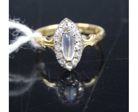 An 18ct gold cabochon moonstone and old cut diamond set elliptical ring, setting dimensions 14.1 x 7.4mm, size N, 2.7g