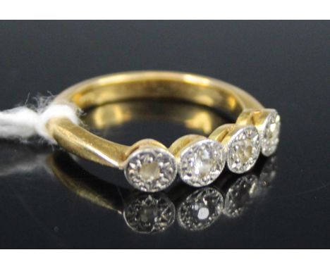 An 18ct gold and platinum diamond set half-hoop ring, arranged as four illusion sets being two old round cuts and two rose cu