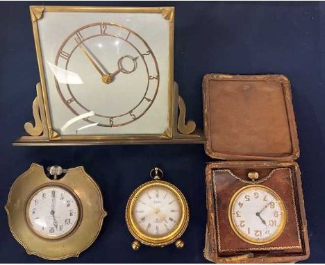 An Art Deco brass framed bedside clock, the white enamel dial showing Arabic markers, having an eight-day movement, h.10cm; t