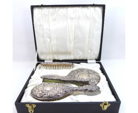 A Victorian style four-piece silver-backed dressing table set, to include a hand mirror, hairbrush, clothes brush and comb, i