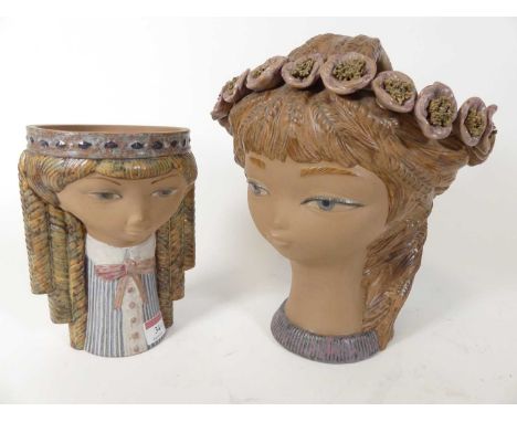 A Lladro porcelain jardiniere, in the form of the head of a young girl, h.28cm; together with another similar (2)No signs of 