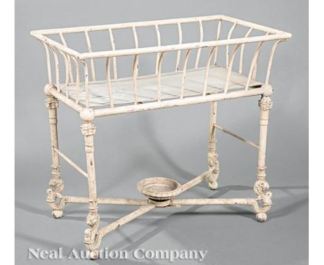 Antique English Painted Cast Iron Planter, flared basket on columnar supports, X stretcher surmounted by an urn, h. 27 in., w